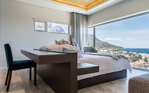 Clever design makes the functional fabulous in the main bedroom on the upper level. Working or relaxing, views are uninterrupted.