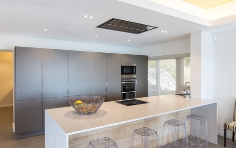 With everything that opens and shuts, the sleek, fully equipped chef’s kitchen on the middle level is an entertainers dream.