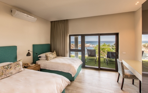 Bedroom 3, with its 2 generous ¾ beds is perfect for sharing & boasts access to the ground floor patio.
