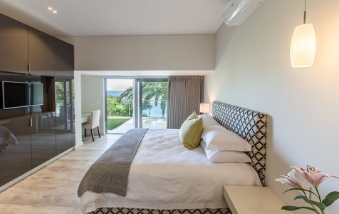 Bedroom 4 offers an en suite bathroom & access to the ground floor patio. Let the sea breeze in to create a true Zen experience.