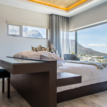 Clever design makes the functional fabulous in the main bedroom on the upper level. Whether you need to work at the desk or it’s time for bed your views of the Atlantic Ocean and magnificent mountains are uninterrupted.