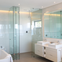 The main bedroom’s full en suite bathroom is fresh and airy, featuring a bath, shower and bidet.