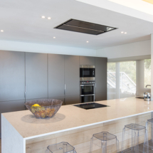 With everything that opens and shuts, the sleek, fully equipped chef’s kitchen on the middle level is an entertainers dream.