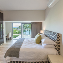 Bedroom 4 offers an en suite bathroom and direct access to the ground floor patio where you can let the sea breeze in to create a true Zen experience.